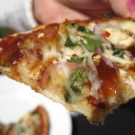 Barbecue Chicken Pizza close up with bite missing