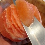 cutting grapefruit segments