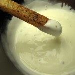 French Fry being dipped in Truffle Mayonnaise